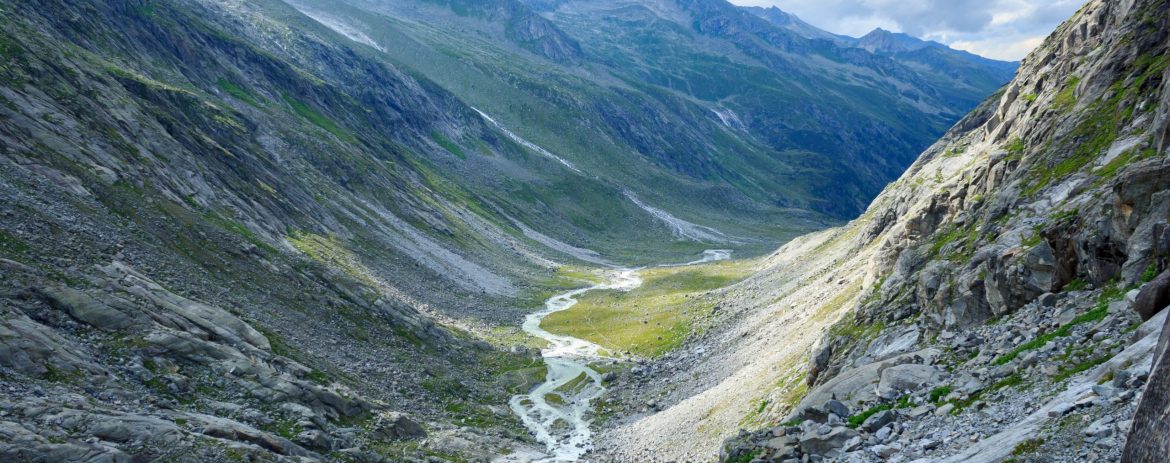 river and green rock mountain at day time