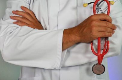 doctor holding red stethoscope