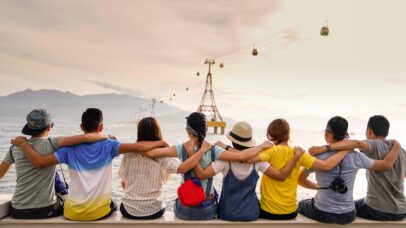 Photo by Duy Pham people holding shoulders sitting on wall