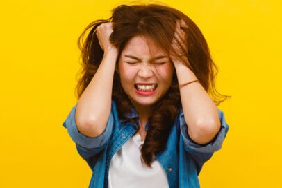 Portrait of young Asian lady with negative expression, excited s